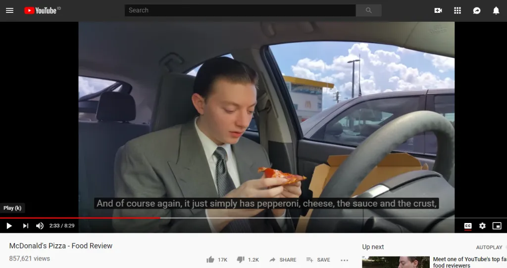screenshot of youtube video of a person doing pizza review
