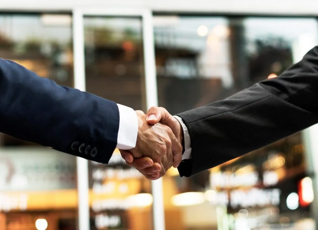 two people shaking hands