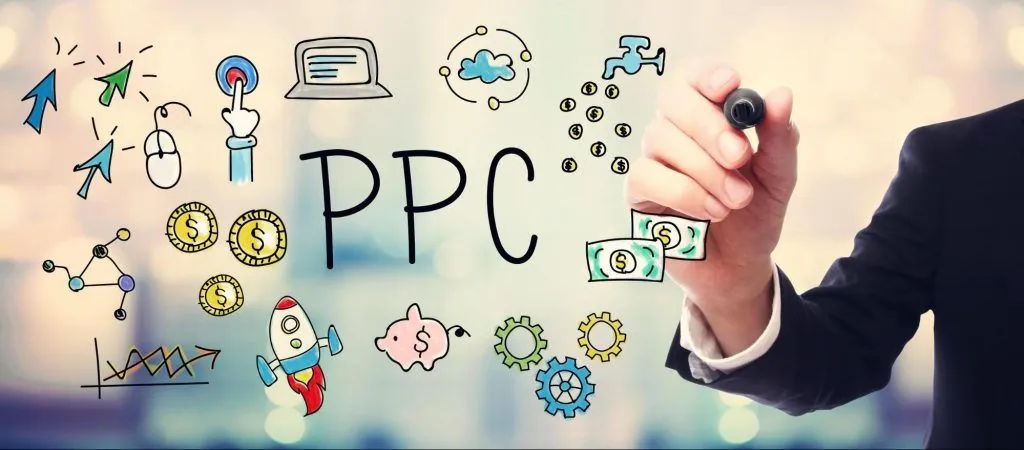 man drawing cartoonish icons related to PPC