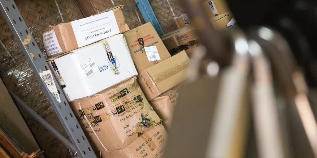 Pile of boxes in stock showing the benefit of inventory management